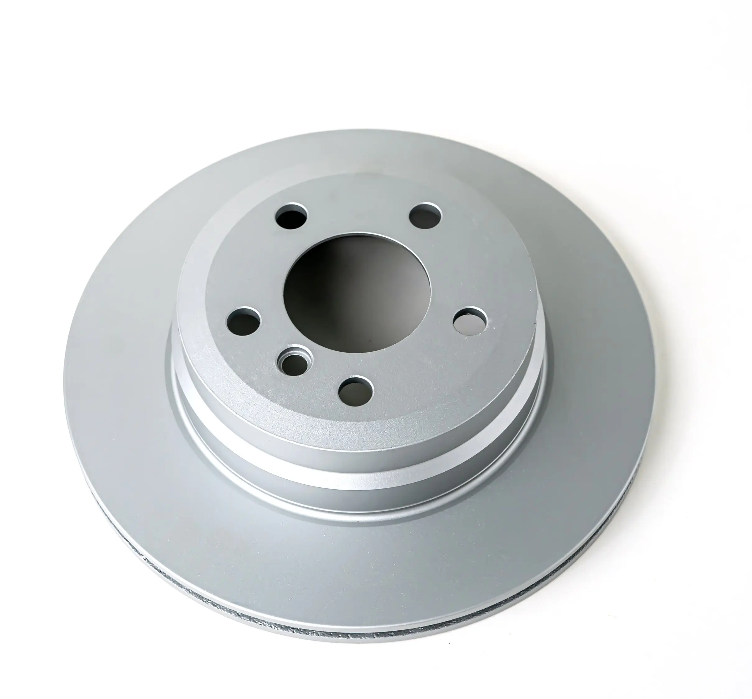 Silver brake disk with multiple holes, top view, shown on a white background, featuring a smooth and polished surface.