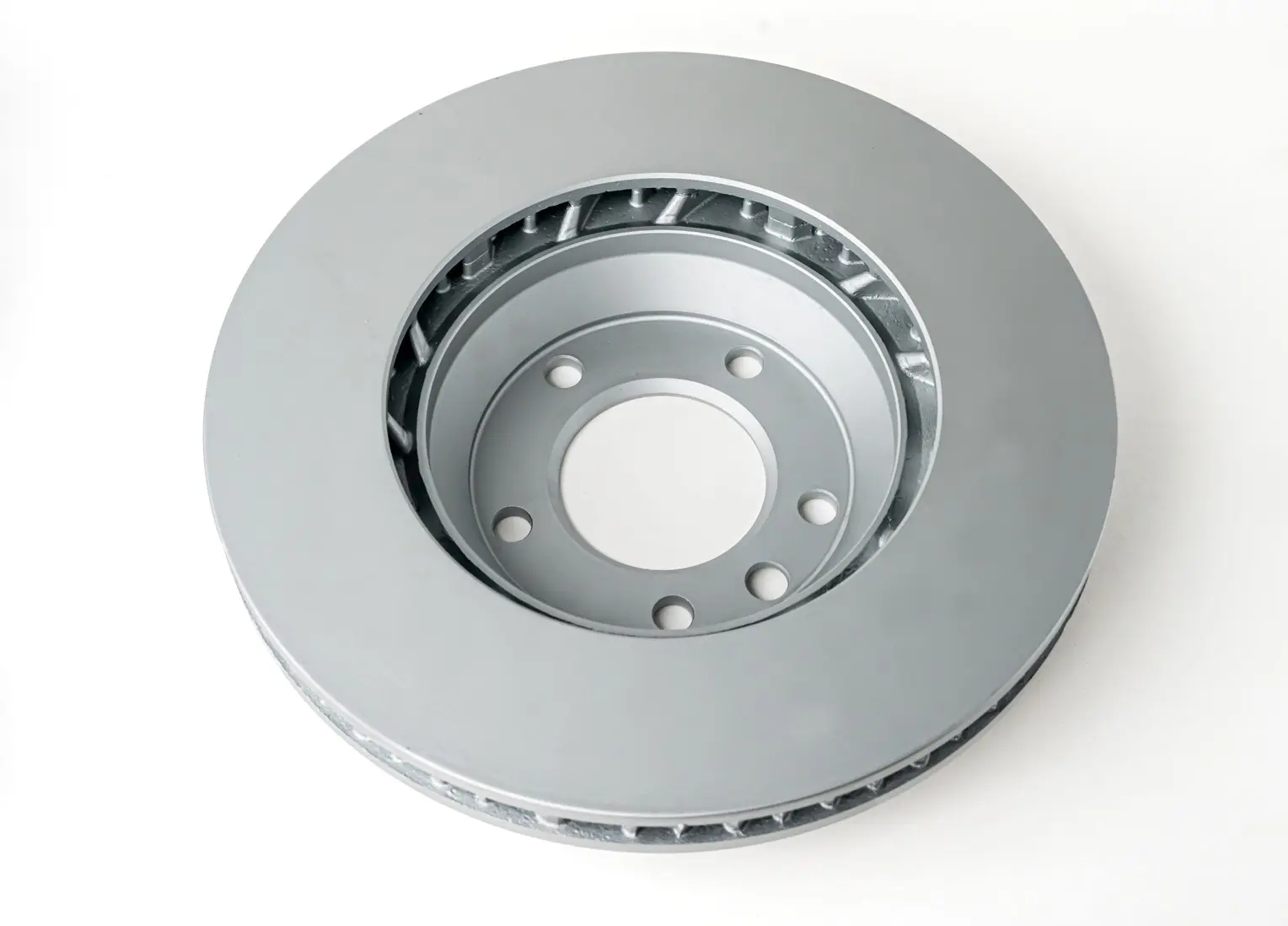 A top view of a vented brake disc showing the inner structure and multiple mounting holes around the center.