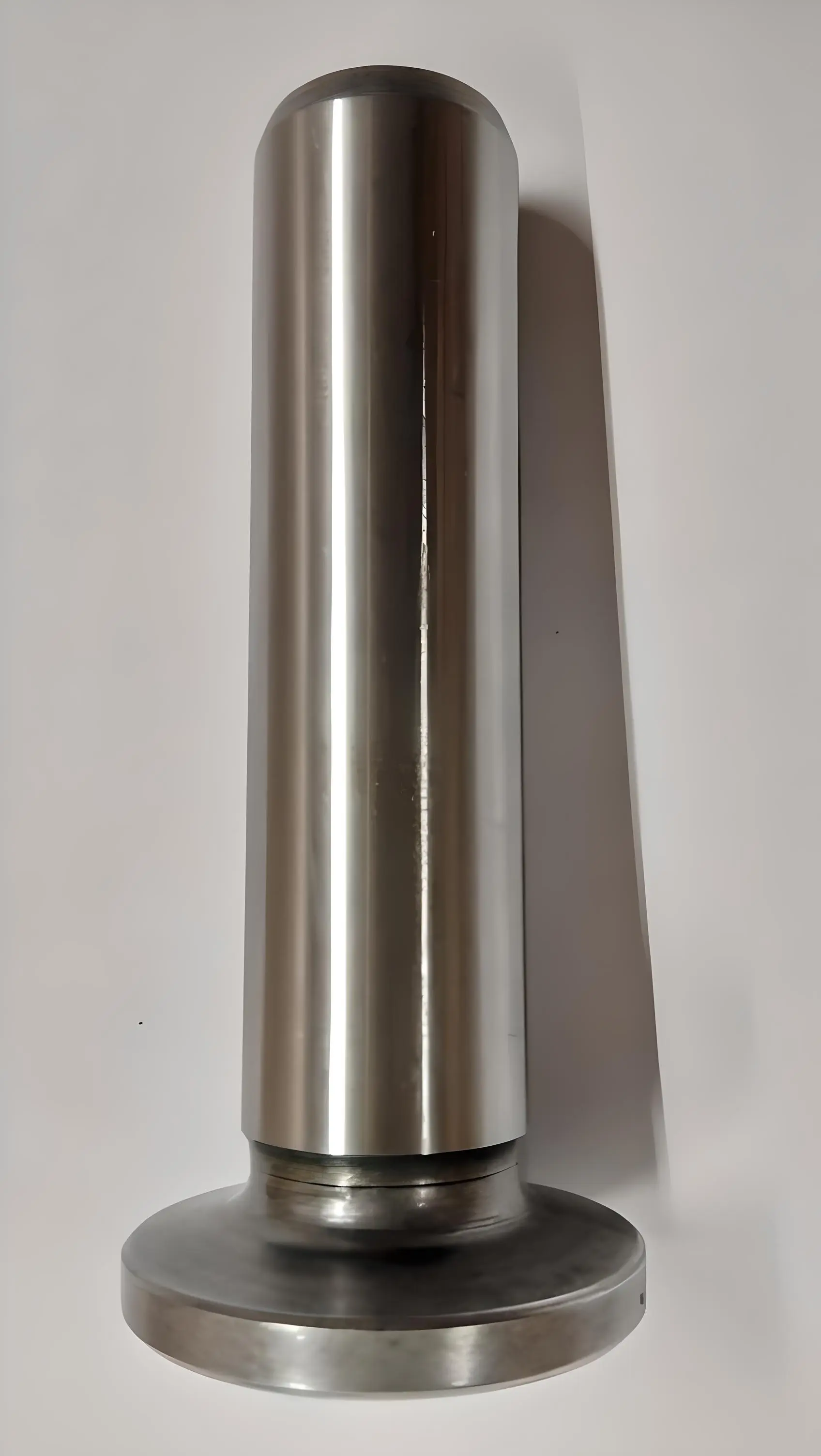 Side view of a cylindrical metal valve tappet, displayed on a white background.