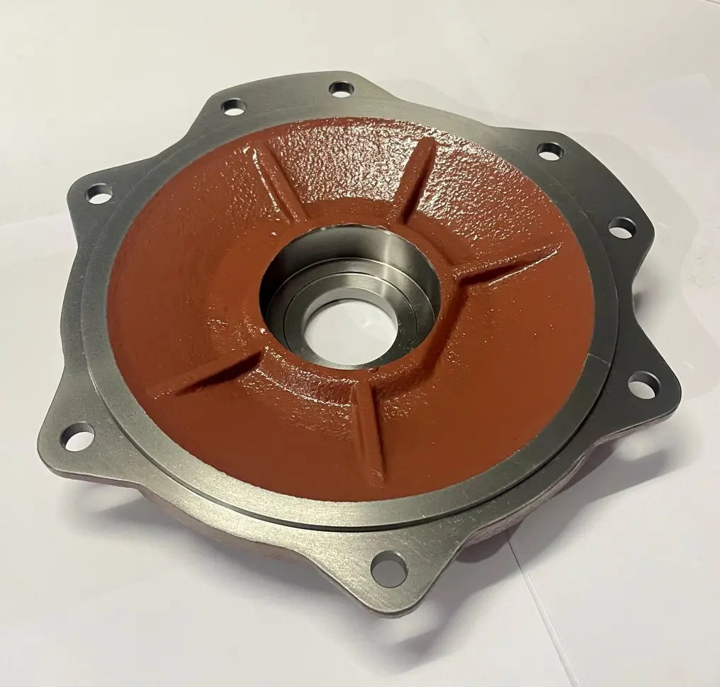 A metal cover component with a textured red base, multiple bolt holes, and a central circular opening, displayed on a white background.