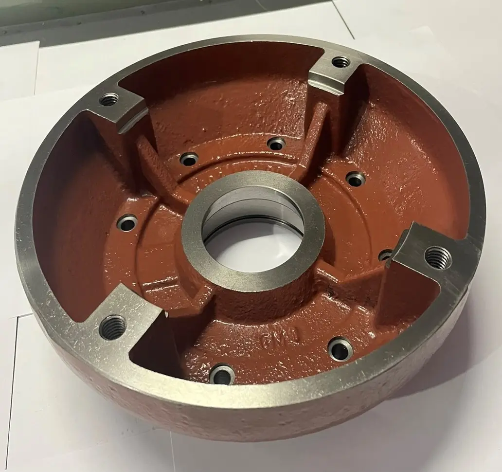 A metal housing component with a red textured finish, multiple bolt holes, and a central circular opening, displayed on a white background.