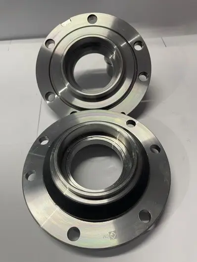 Two metal flange components with multiple bolt holes, displayed on a white background.
