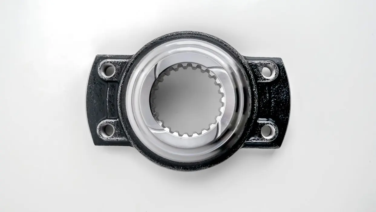 A metal yoke component with a splined circular opening and bolt holes, displayed on a white background.